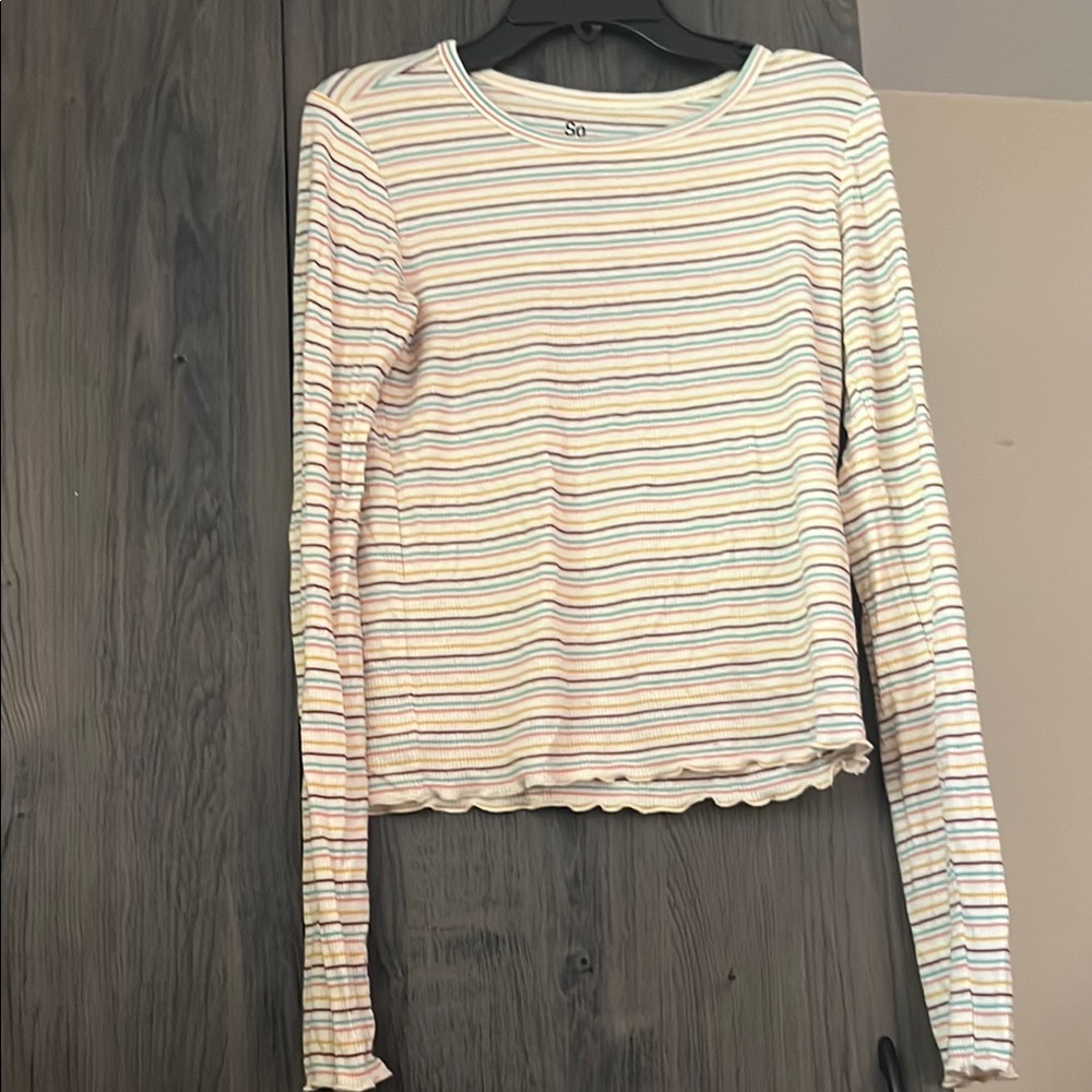 Creamy off-white and terra cotta long-sleeved ribbed knit top